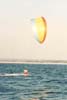 Kitesailing at sea, far from watchers and accompanied by an inflatabe tender